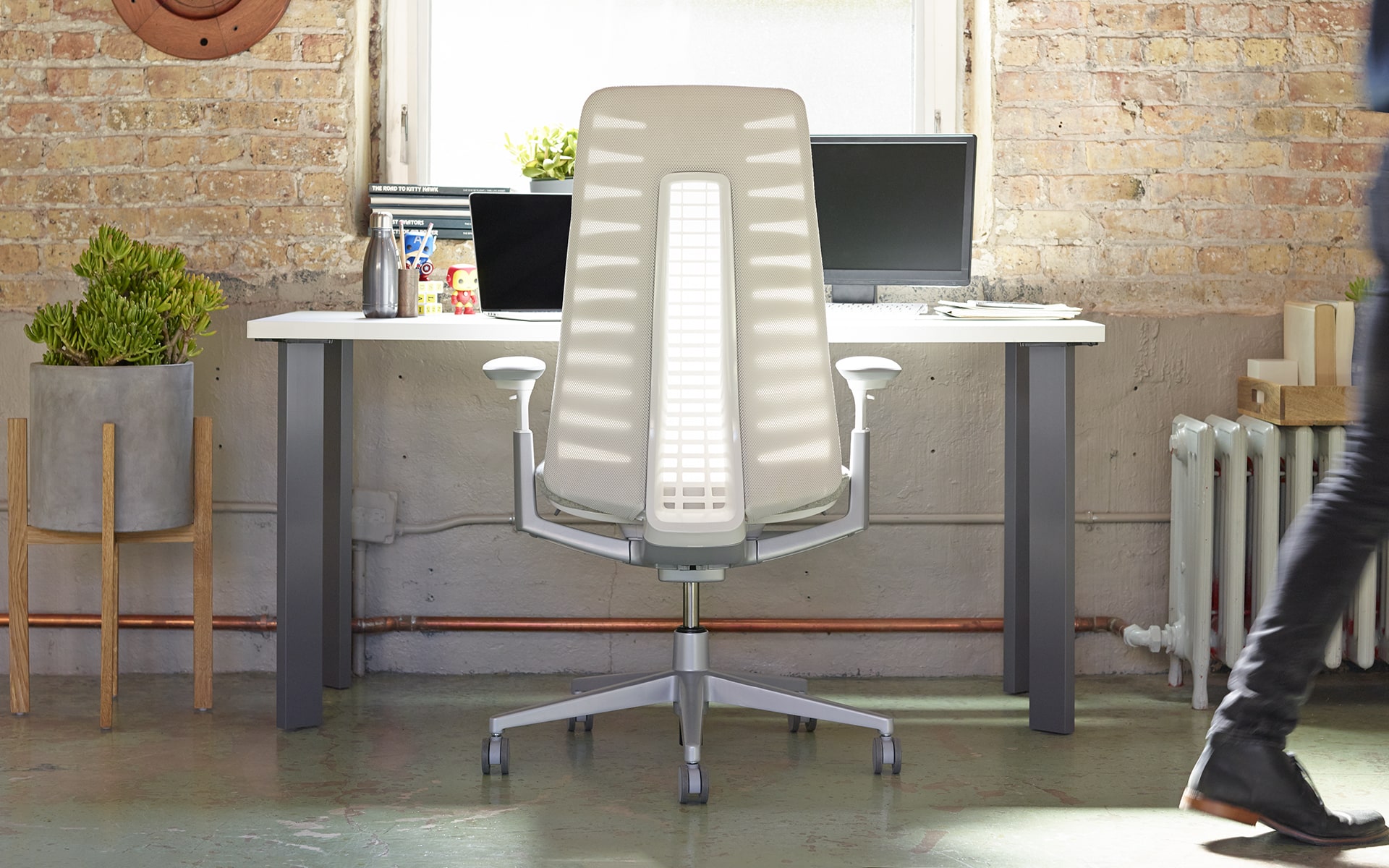 Haworth Fern office chair by ITO Design with white backrest at industrial chic workplace